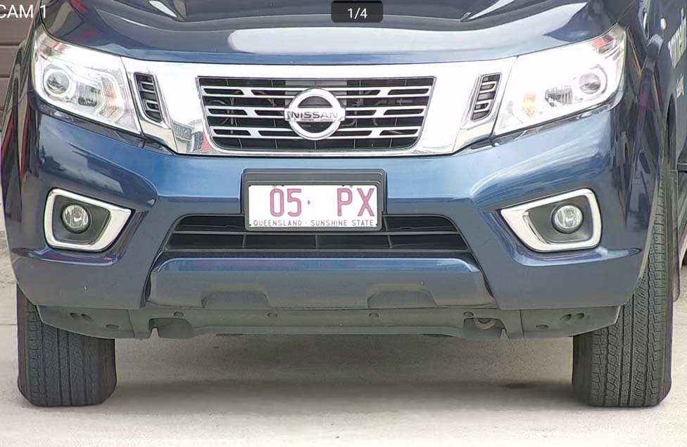 Close up image of a car number plate from a security camera